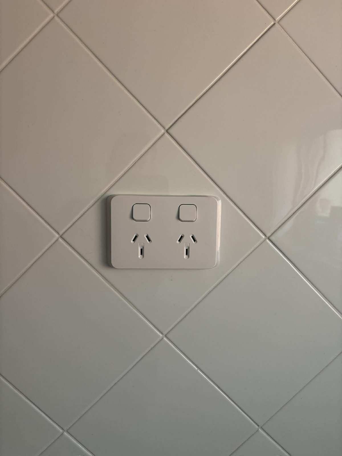 Modern double GPO installed on tiled splashback in Newcastle