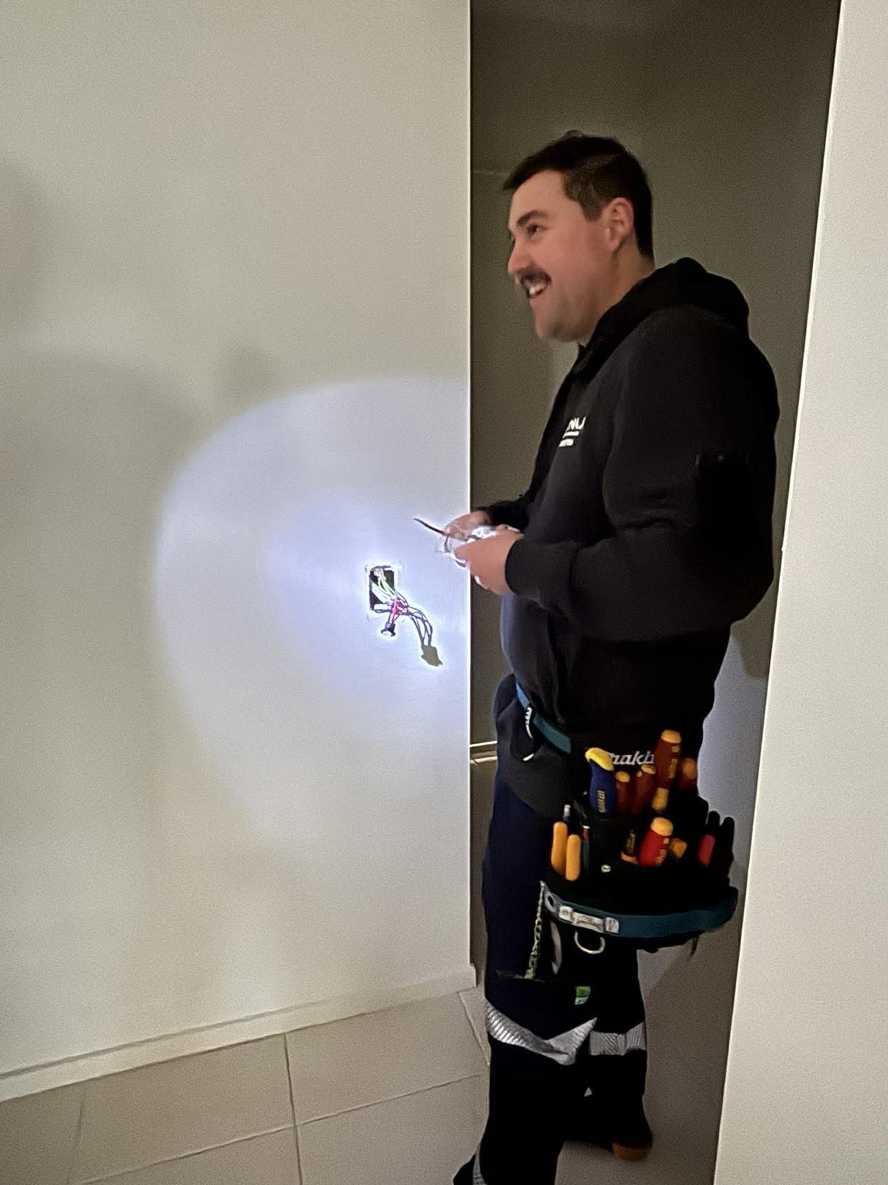 Nate from Nate's Rates Electrical diagnosing a faulty powerpoint in a Newcastle home