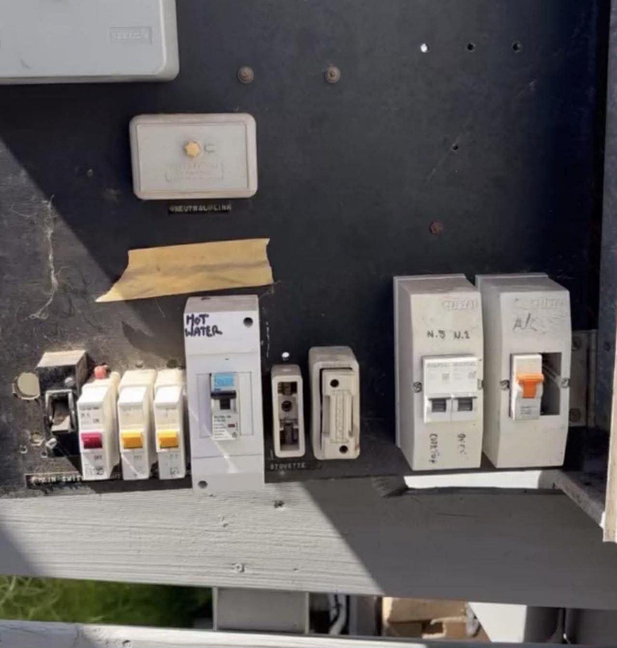 Old ceramic fuse switchboard with rewireable fuses